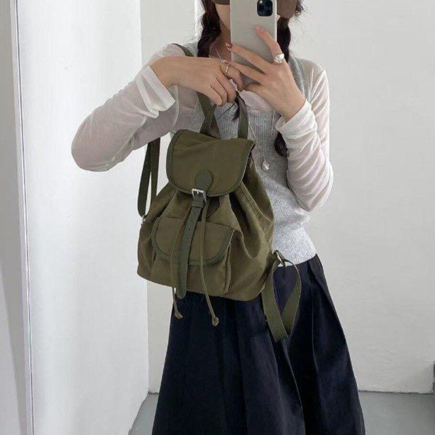 Lightweight Drawstring Flap Mini Backpack With Front Slip Pocket, Metal Slider Buckle Fastener And Integrated Top Carry Grip