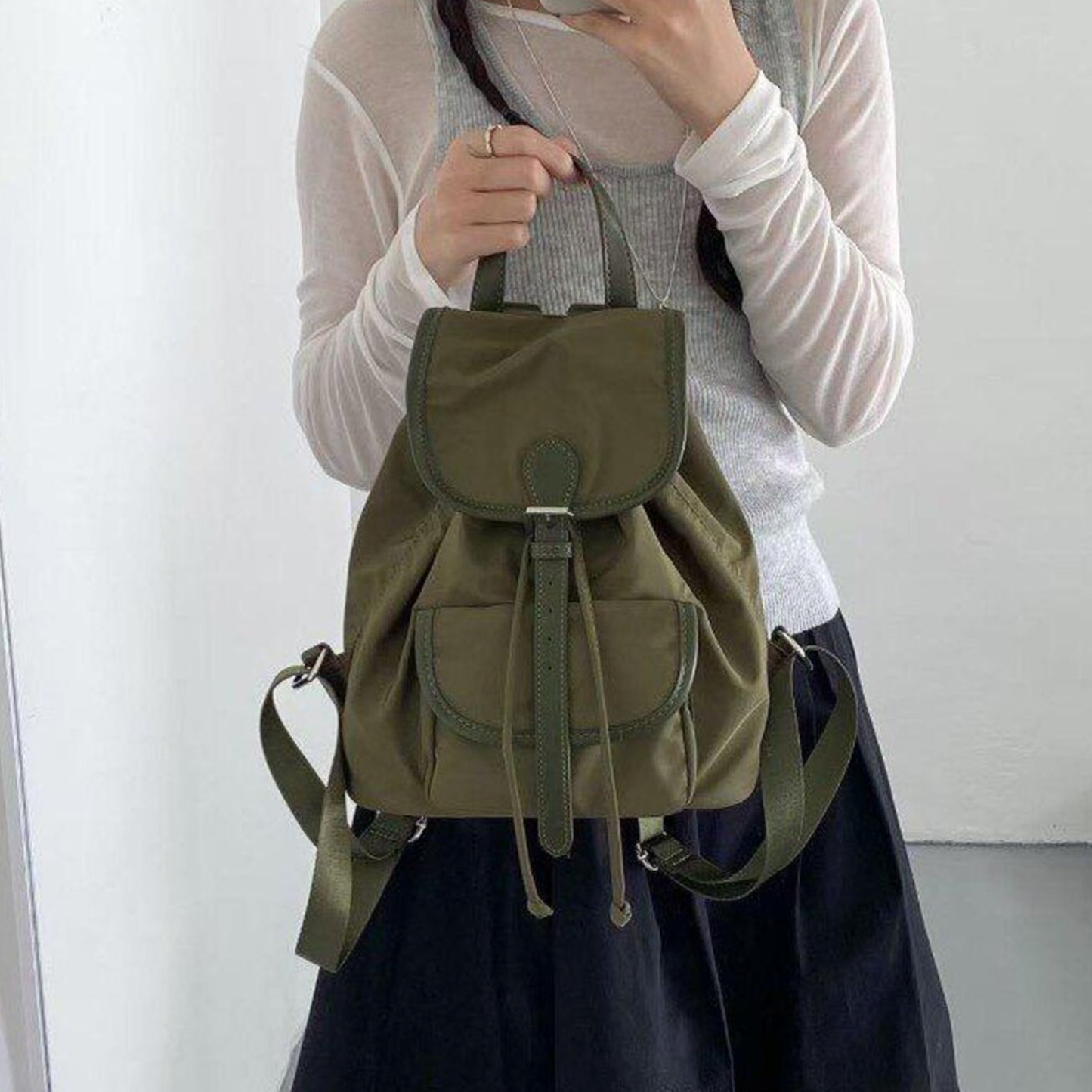 Lightweight Drawstring Flap Mini Backpack With Front Slip Pocket, Metal Slider Buckle Fastener And Integrated Top Carry Grip